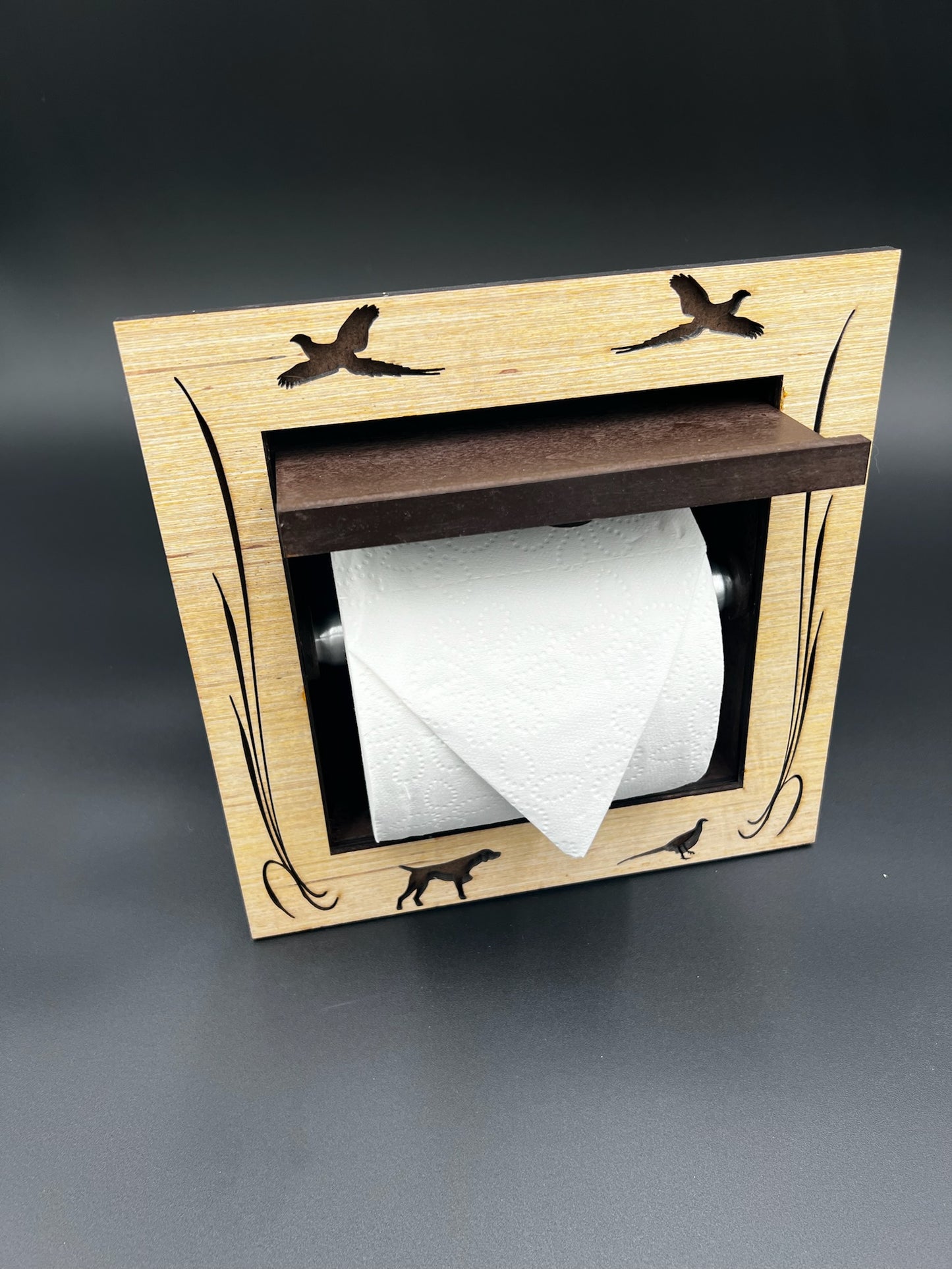 Recessed toilet tissue holder compartment.