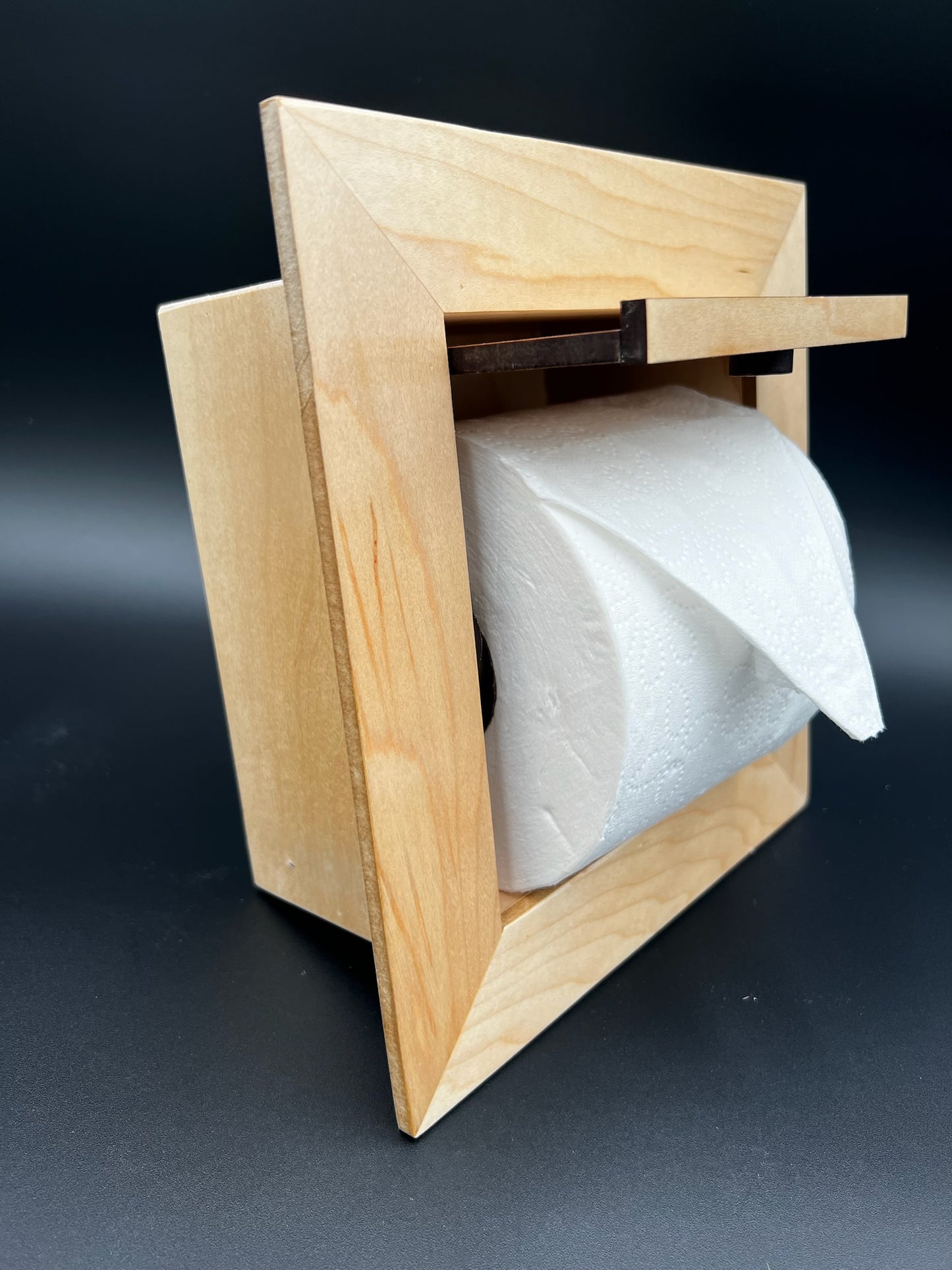 Recessed toilet tissue holder compartment.