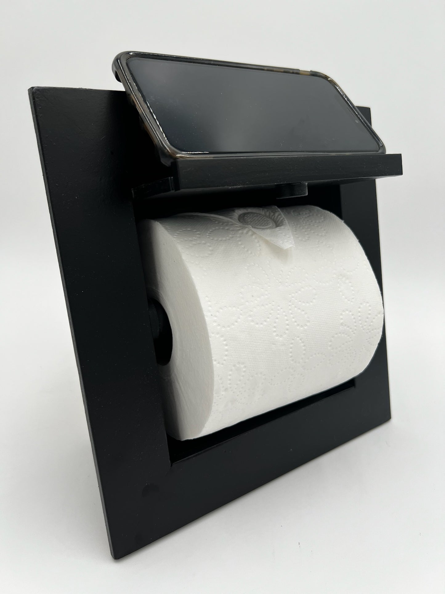 Recessed toilet tissue holder compartment.