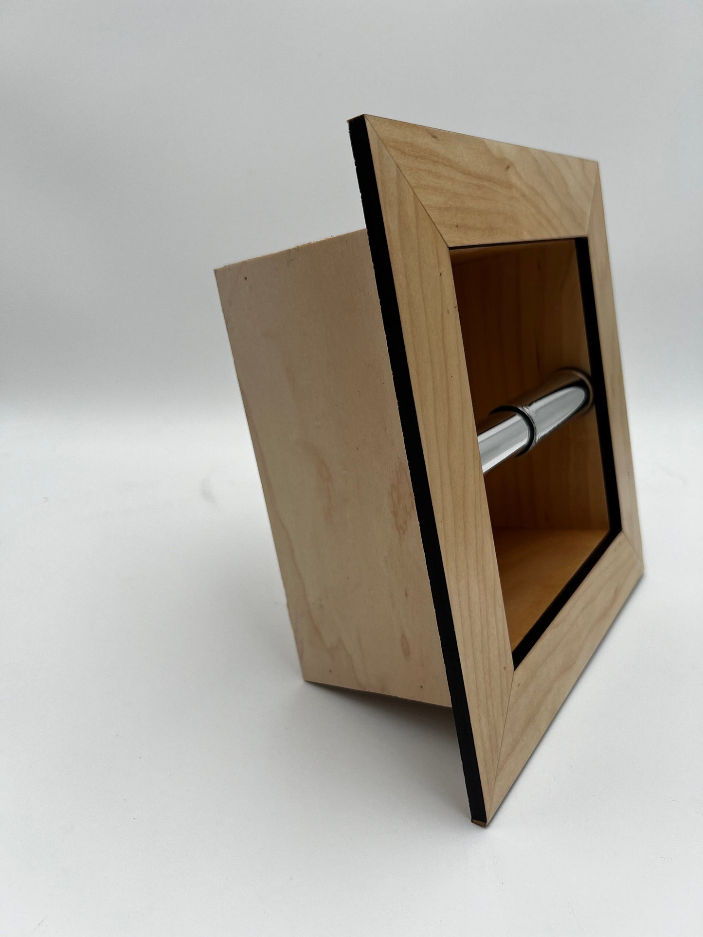 Recessed toilet tissue holder compartment.