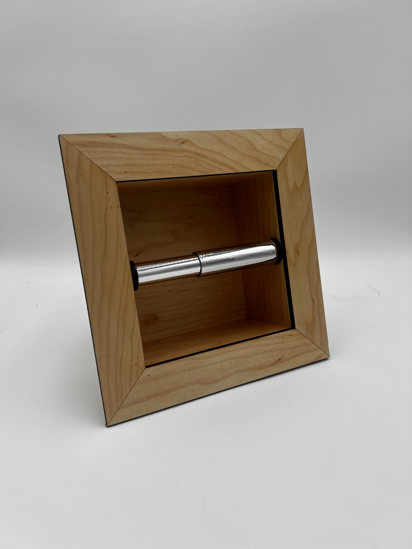 Recessed toilet tissue holder compartment.